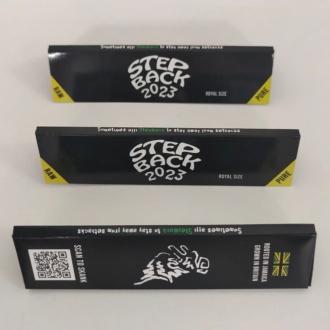 Custom rolling paper printed booklets with 'Step Back 2023' branding for music artist reek0.